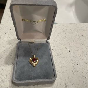 Gold with garnet and small diamond  accents necklace